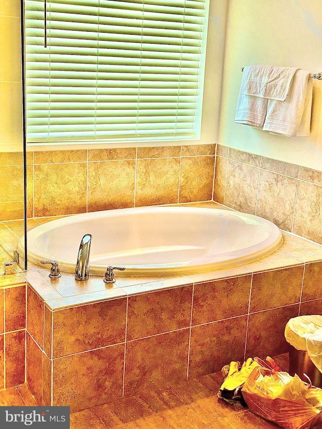 bathroom with tiled tub