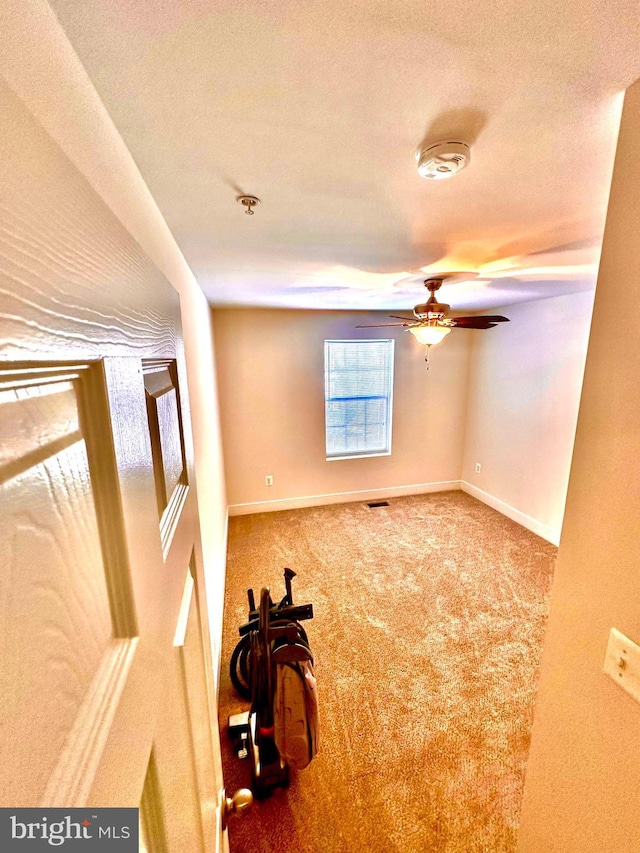 carpeted spare room with a textured ceiling