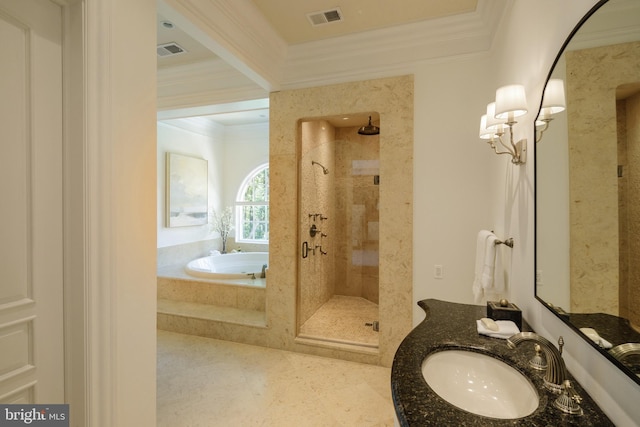 bathroom featuring a garden tub, visible vents, and crown molding