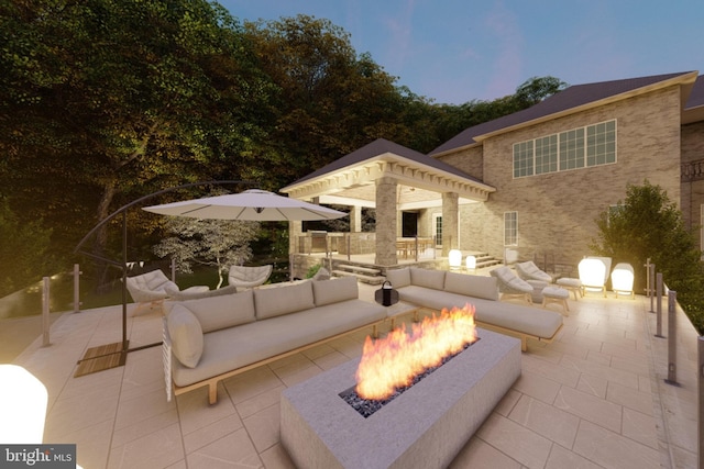 view of patio featuring an outdoor living space with a fire pit