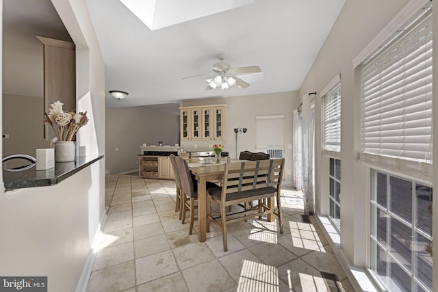 dining area with ceiling fan and light tile patterned floors