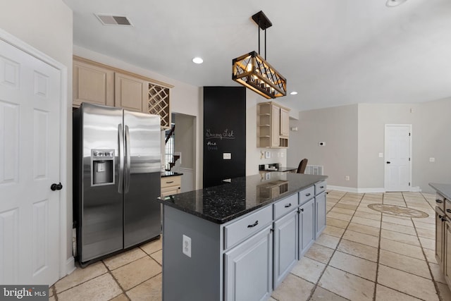 kitchen featuring a center island, open shelves, gray cabinets, visible vents, and stainless steel fridge with ice dispenser