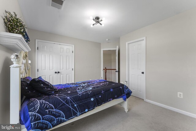 carpeted bedroom with a closet