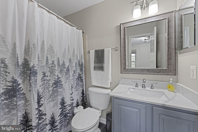 full bathroom with toilet, curtained shower, and vanity