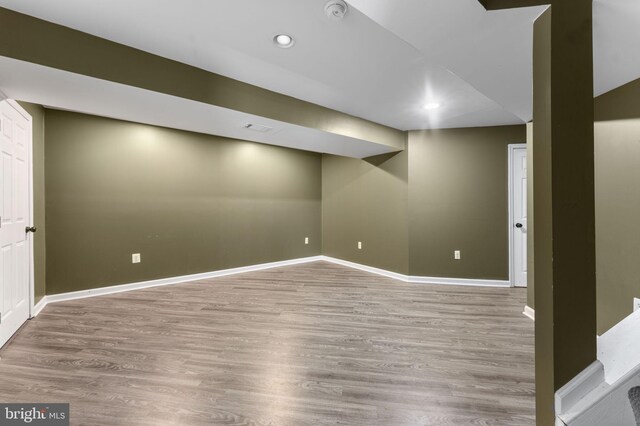 unfurnished room with hardwood / wood-style floors