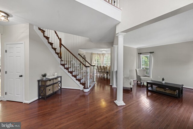 living room with ceiling fan, plenty of natural light, and carpet floors