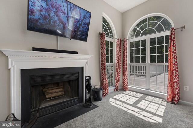 living room featuring ceiling fan and light carpet