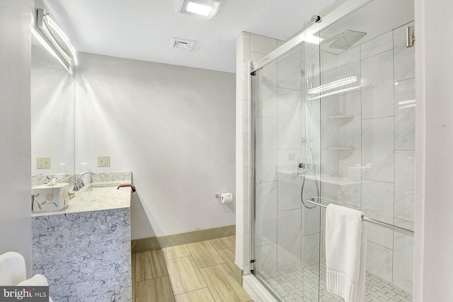 bathroom with vanity and walk in shower