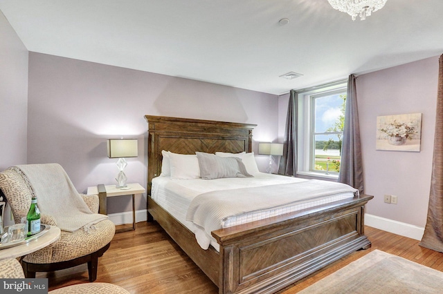 bedroom with light wood-type flooring