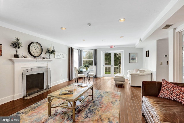 living room with french doors and hardwood / wood-style floors