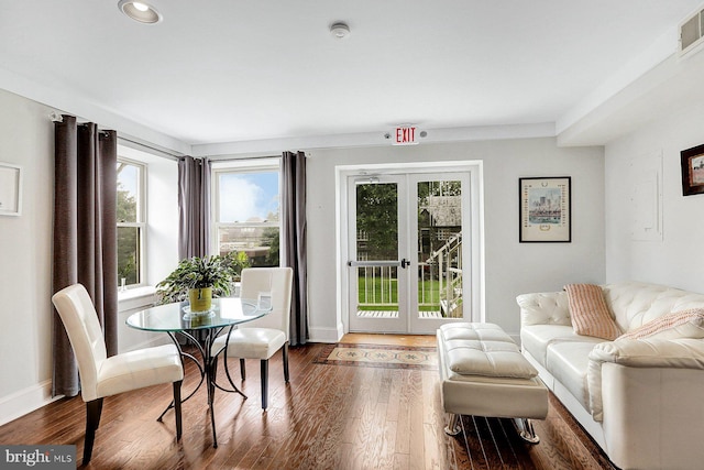 living room featuring french doors and dark hardwood / wood-style flooring