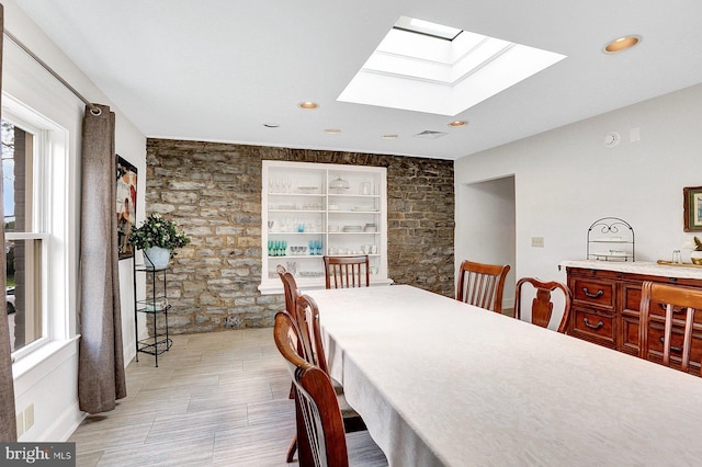 dining space with a skylight