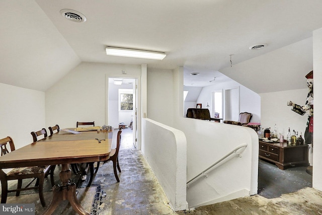 interior space featuring a healthy amount of sunlight and vaulted ceiling