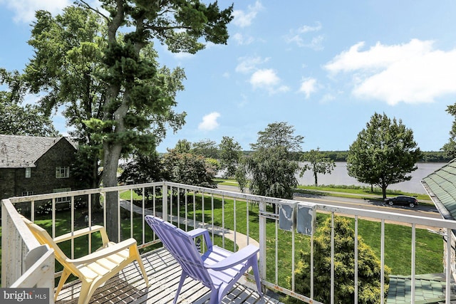 balcony featuring a water view