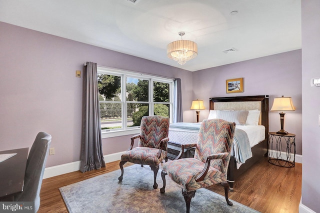 bedroom with dark hardwood / wood-style floors