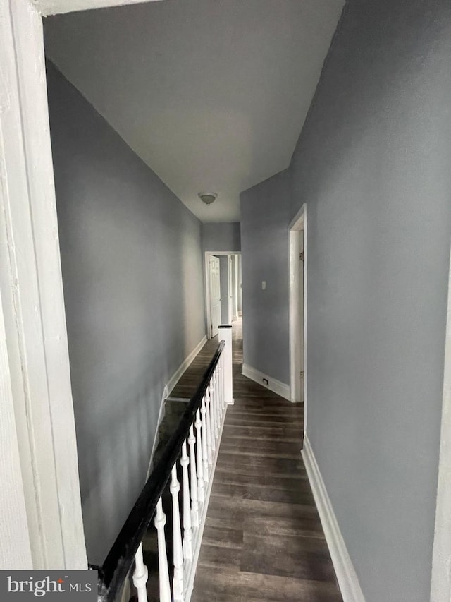 hallway featuring dark hardwood / wood-style floors