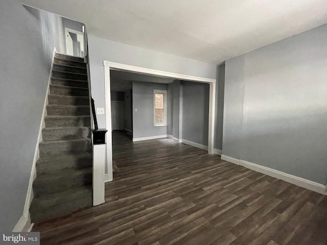 spare room featuring dark hardwood / wood-style floors