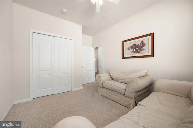 interior space with light carpet and ceiling fan