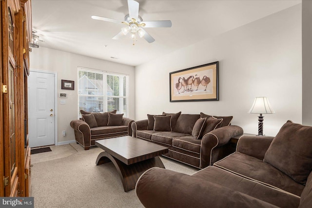 carpeted living room featuring ceiling fan