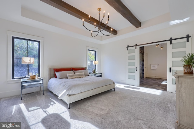 carpeted bedroom featuring beamed ceiling, a raised ceiling, and a barn door