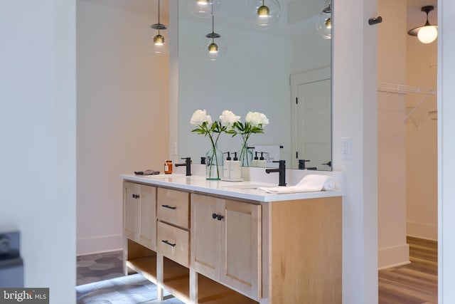 bathroom featuring vanity and wood-type flooring