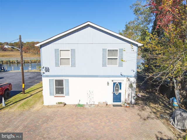 view of front of home featuring a water view