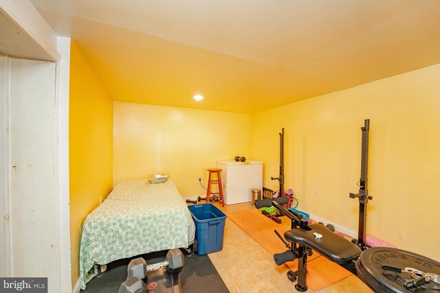 bedroom featuring light tile patterned floors