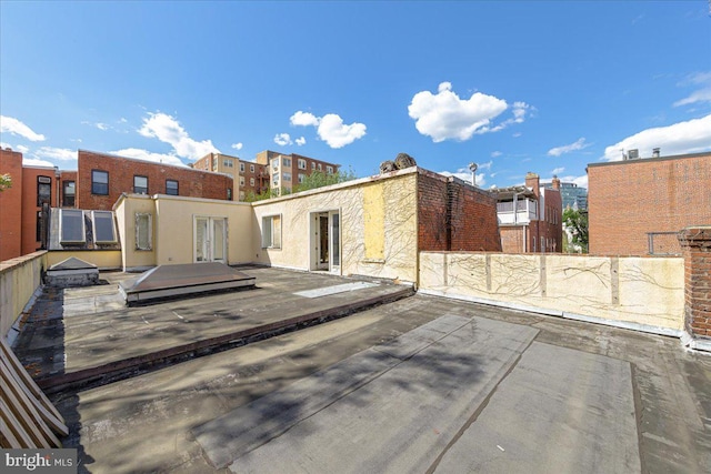 rear view of property with fence and a patio