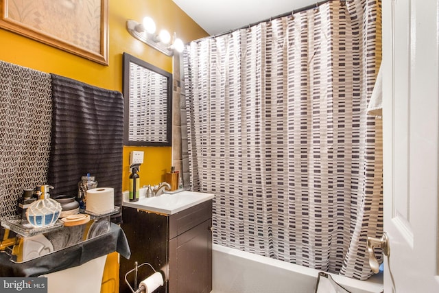 bathroom with shower / bath combination with curtain and vanity