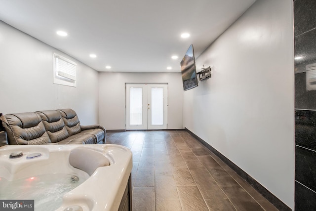 living room featuring baseboards, french doors, dark wood-type flooring, and recessed lighting