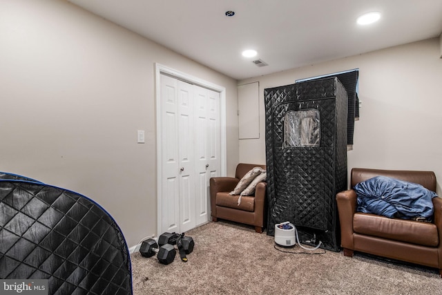 living area with carpet floors, recessed lighting, and visible vents