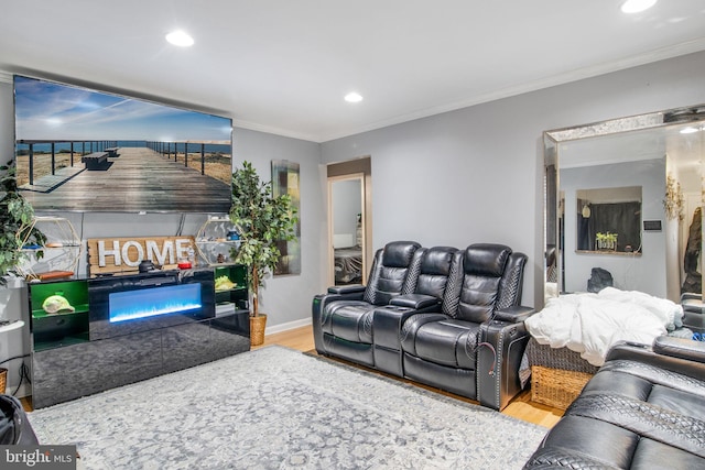 living room featuring light hardwood / wood-style floors and ornamental molding