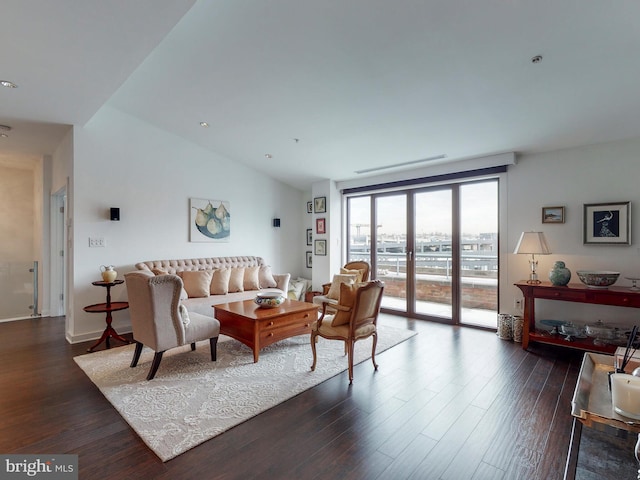 living area with lofted ceiling, dark wood-style floors, and french doors