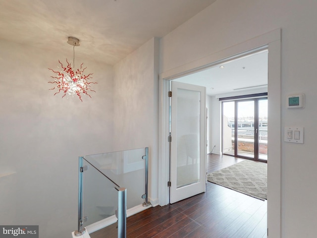 corridor featuring french doors and dark hardwood / wood-style floors