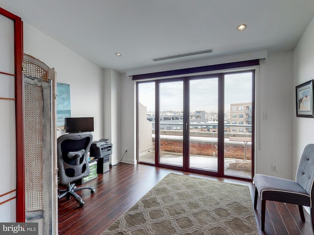 office featuring recessed lighting, dark wood-style flooring, and visible vents