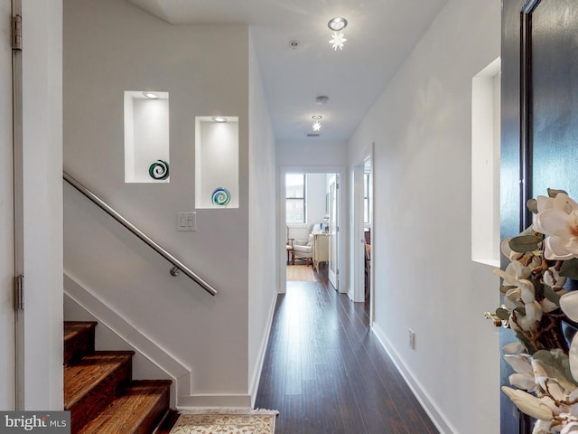 hallway featuring dark hardwood / wood-style floors