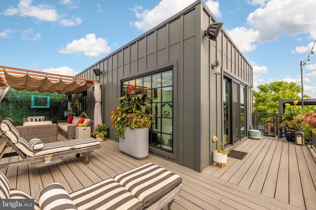 wooden terrace with a pergola