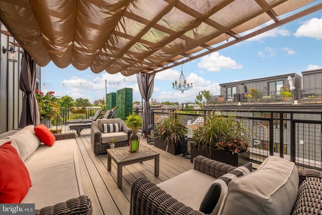 deck featuring a pergola and outdoor lounge area