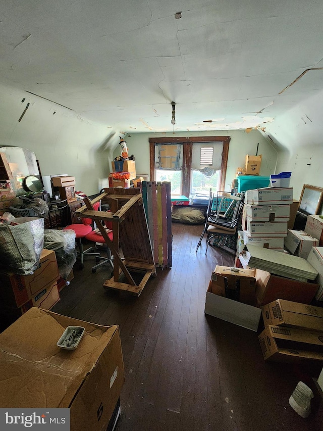 misc room featuring vaulted ceiling and hardwood / wood-style flooring