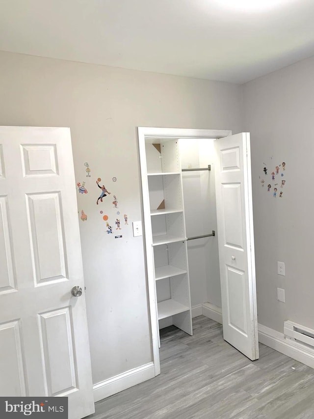 closet featuring a baseboard radiator