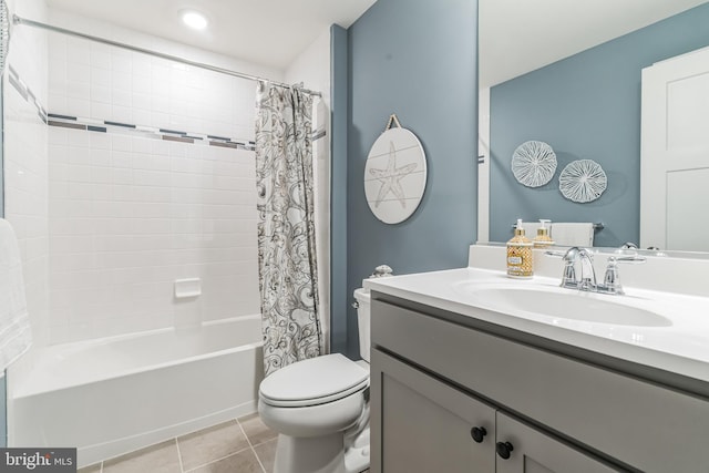 bathroom featuring tile patterned flooring, toilet, vanity, and shower / bath combo with shower curtain