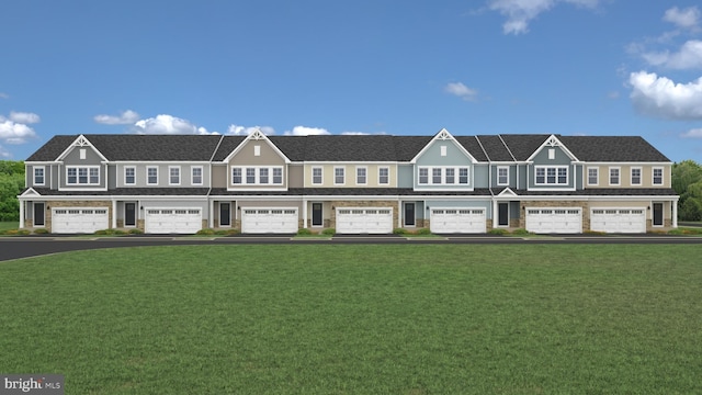 view of front facade with a garage and a front yard