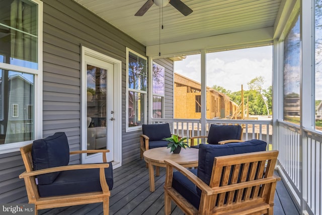 deck with an outdoor hangout area and a ceiling fan