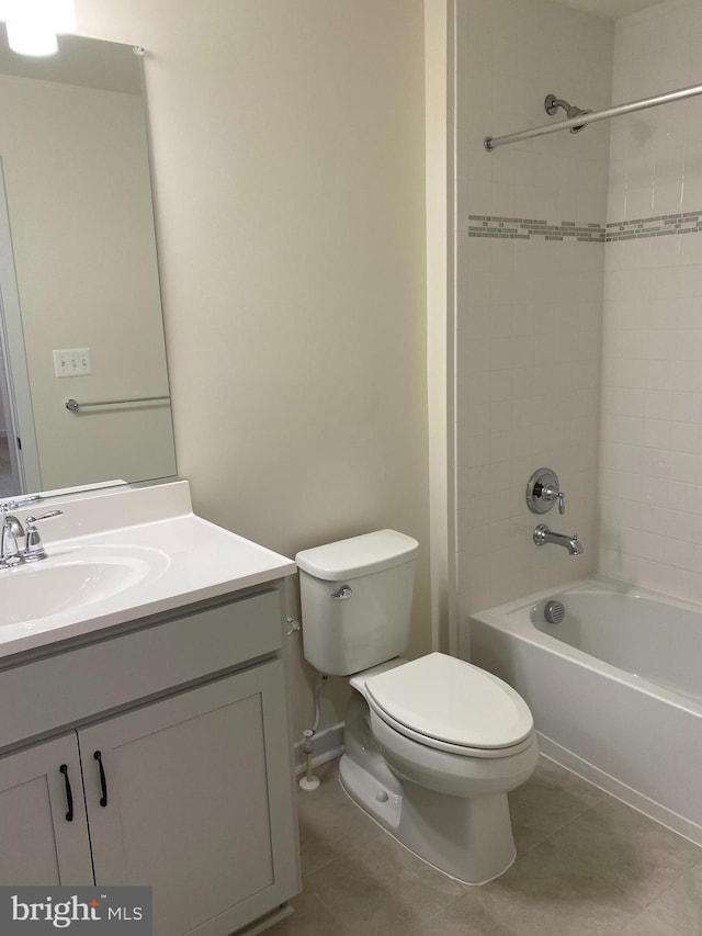 bathroom featuring tile patterned floors, vanity, toilet, and bathing tub / shower combination