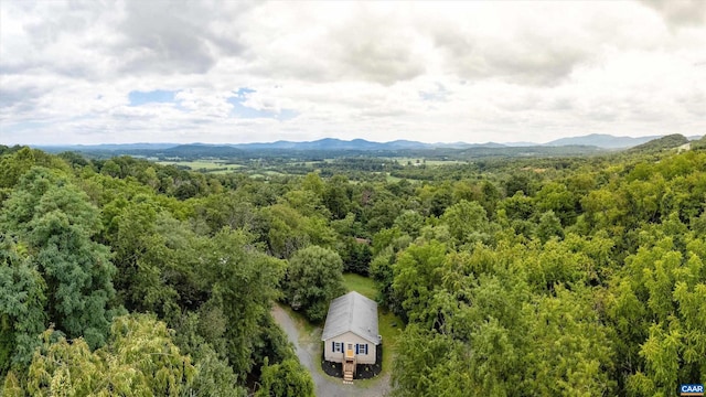 aerial view with a mountain view and a view of trees
