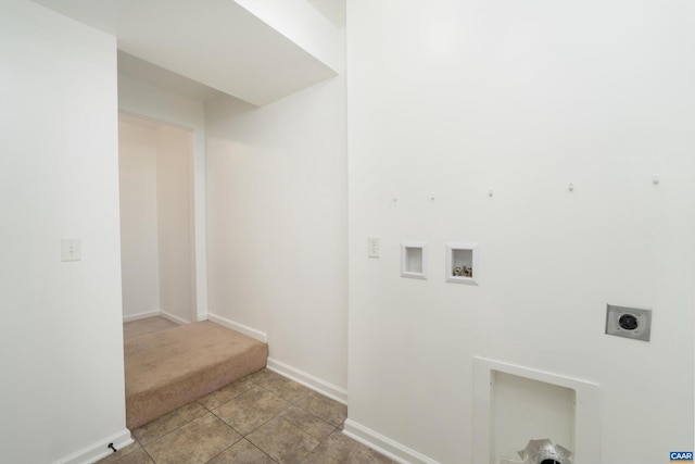 laundry area featuring laundry area, baseboards, washer hookup, electric dryer hookup, and light tile patterned flooring