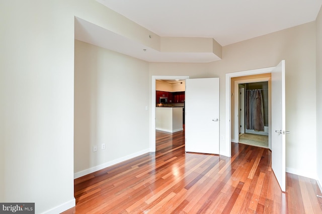 unfurnished bedroom featuring wood-type flooring