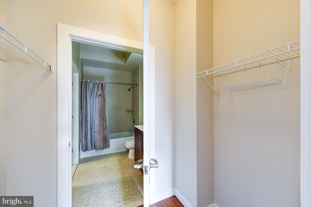 spacious closet with hardwood / wood-style floors