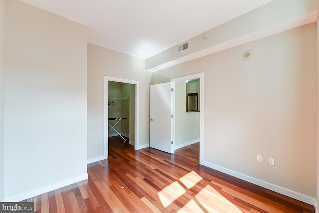 spare room featuring hardwood / wood-style floors