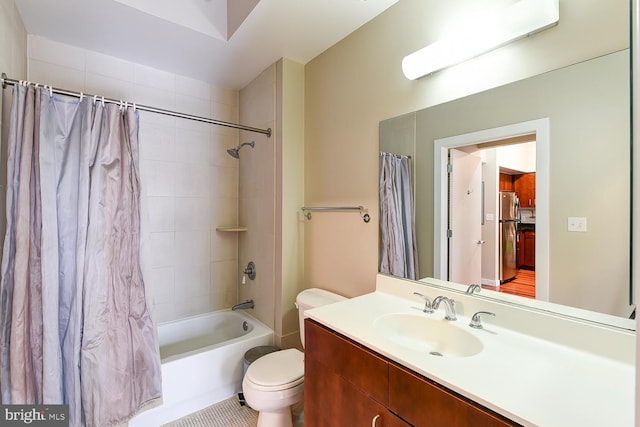 full bathroom featuring tile patterned flooring, shower / bath combination with curtain, toilet, and vanity